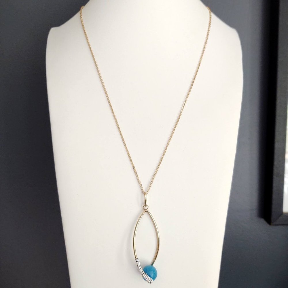 Blue bead, cz and gold pendant necklace